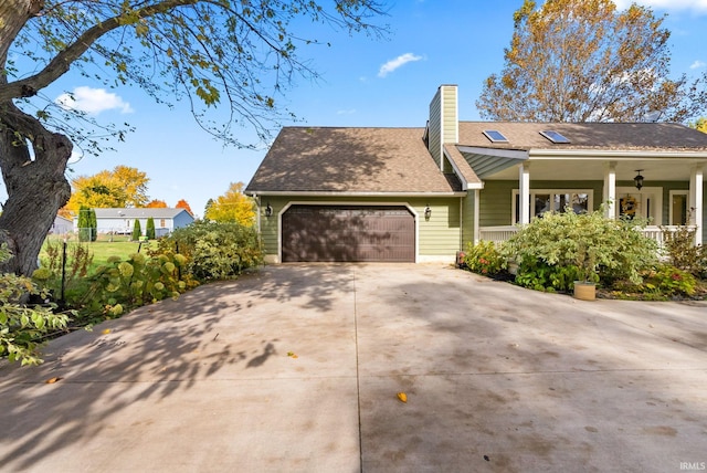 view of front of home featuring covered porch and a garage