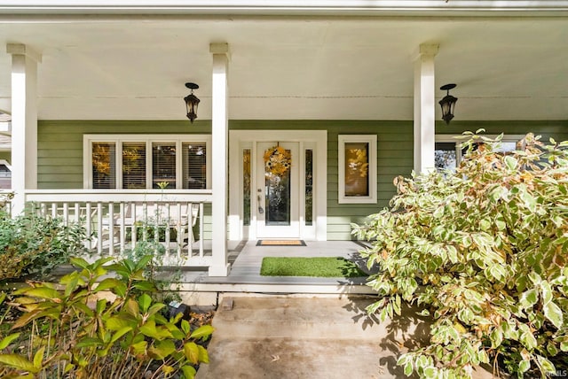 doorway to property with covered porch