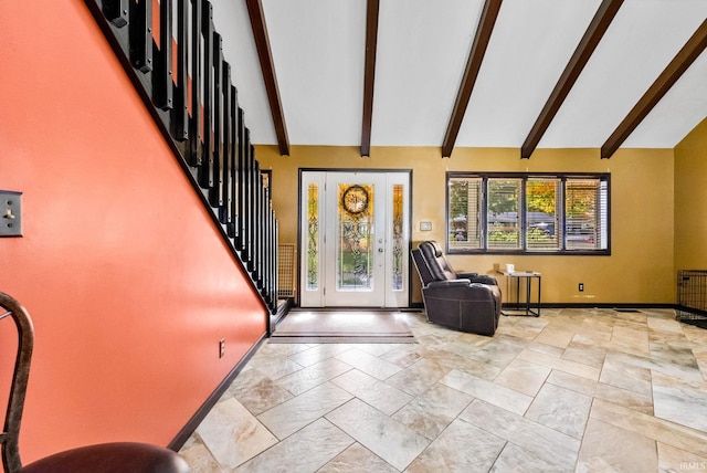 foyer entrance featuring beam ceiling and high vaulted ceiling