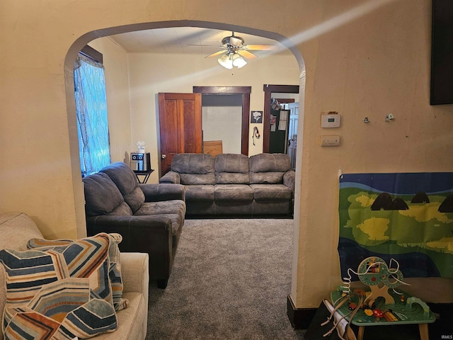 living room featuring carpet floors and ceiling fan