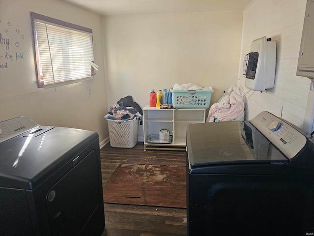 laundry area featuring dark hardwood / wood-style floors and washer and clothes dryer