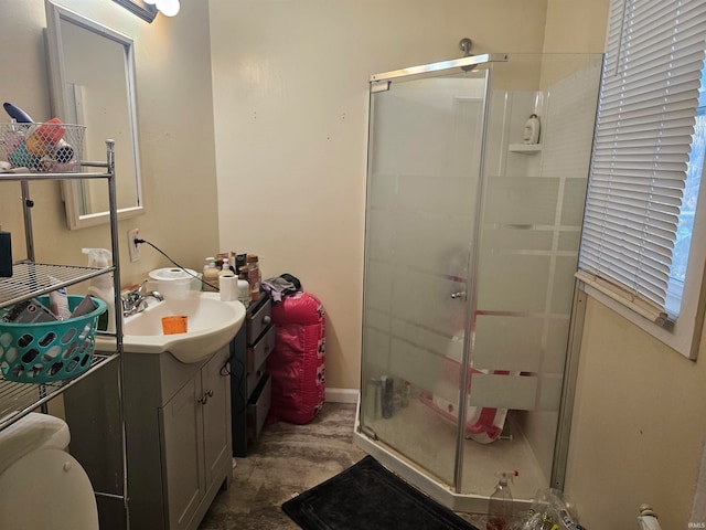 bathroom featuring vanity, an enclosed shower, and toilet