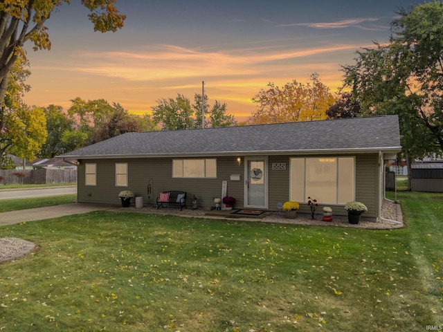 single story home featuring a yard