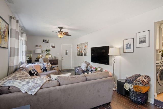 living room with washer / clothes dryer, dark wood-type flooring, and ceiling fan