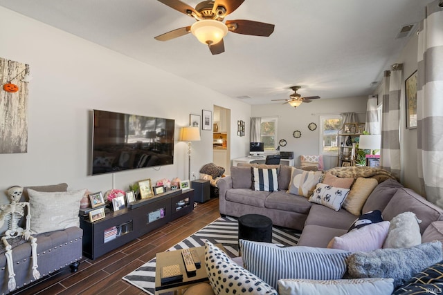 living room with dark hardwood / wood-style floors and ceiling fan