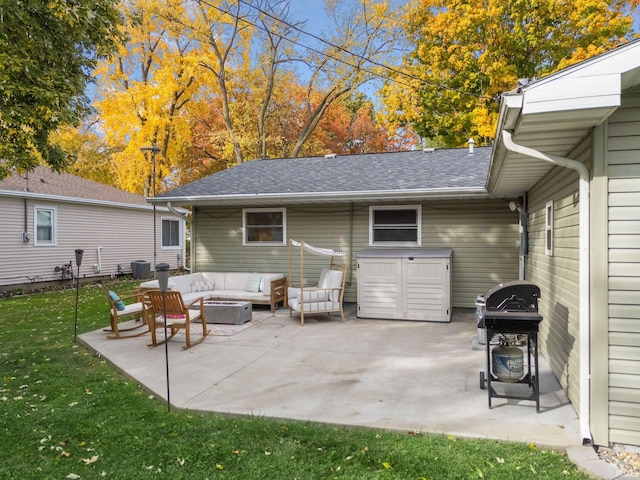 view of patio with cooling unit, a grill, and an outdoor hangout area