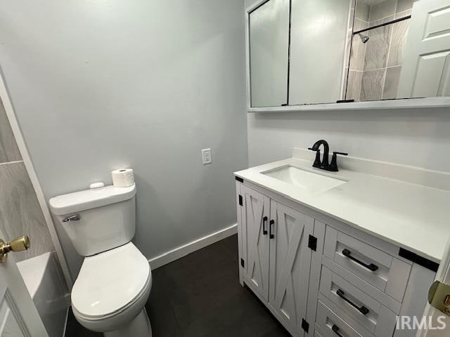 full bathroom featuring vanity, toilet, and washtub / shower combination