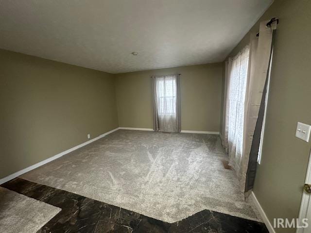 unfurnished room with carpet flooring