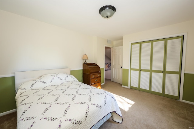 bedroom featuring a closet and carpet floors