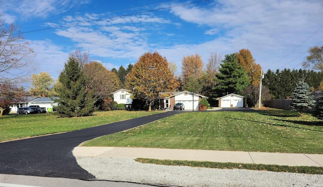 exterior space with a front yard and a garage