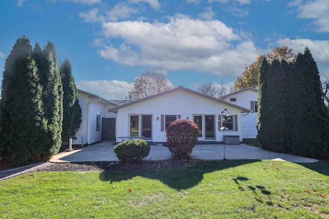 view of front of house with a front lawn and a patio area