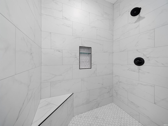 bathroom with tiled shower