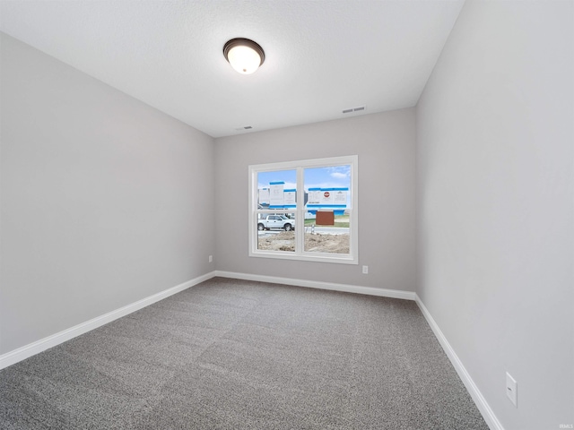 unfurnished room with carpet floors