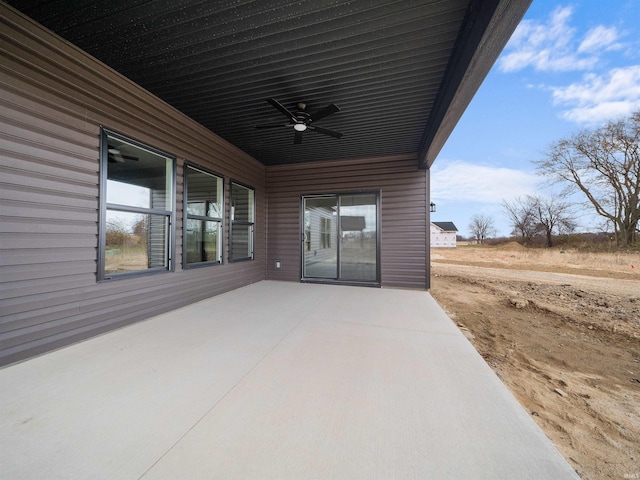 view of patio featuring ceiling fan