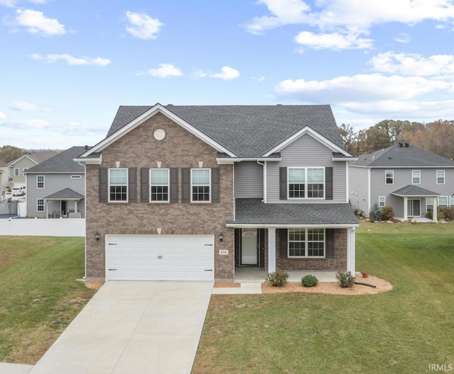 view of front of home with a garage and a front lawn