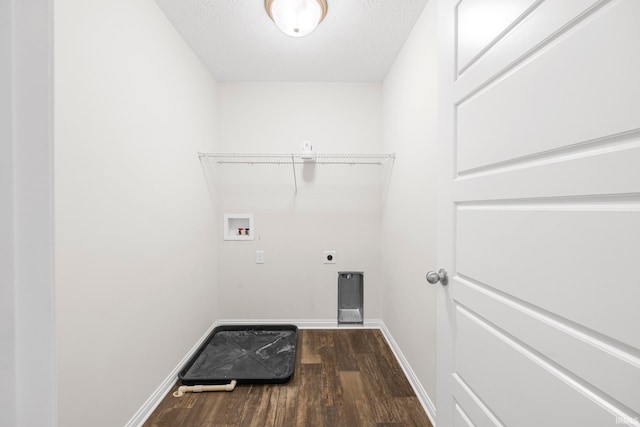 washroom featuring dark hardwood / wood-style flooring, hookup for a washing machine, a textured ceiling, and hookup for an electric dryer