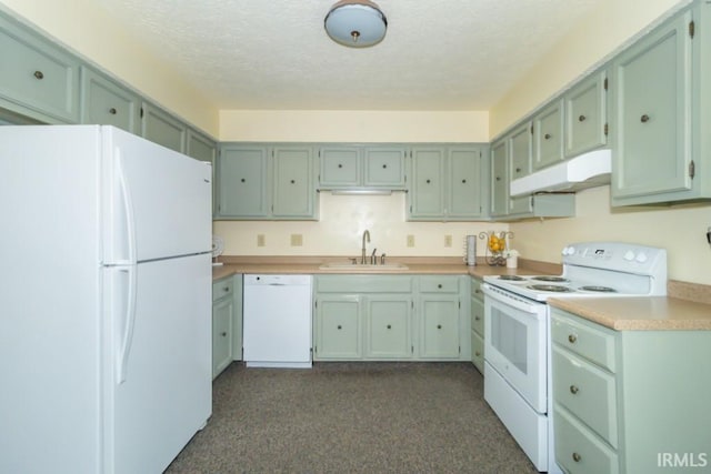 kitchen featuring white appliances, a textured ceiling, sink, and green cabinetry