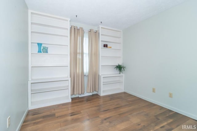 empty room featuring dark hardwood / wood-style floors