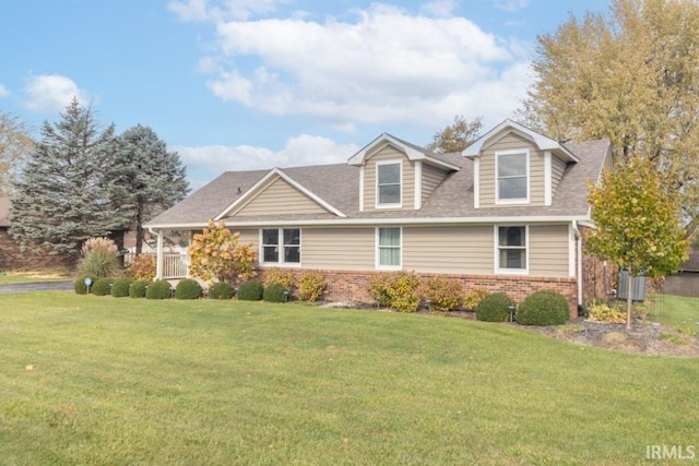 new england style home with a front yard