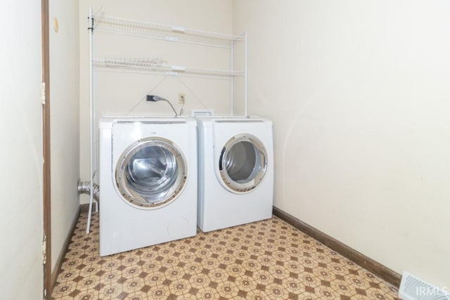 laundry room featuring washing machine and dryer