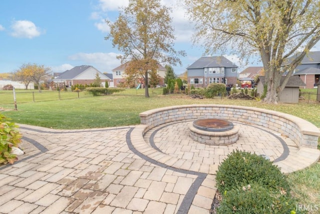 view of patio with a fire pit