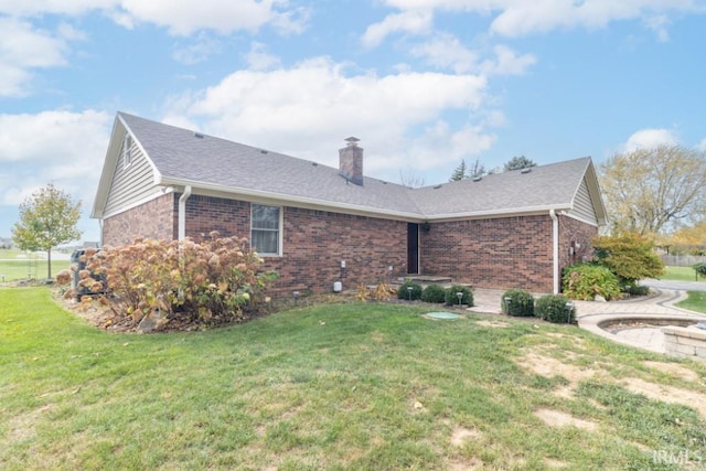 view of side of property featuring a yard