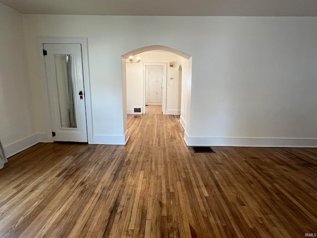 spare room with hardwood / wood-style flooring