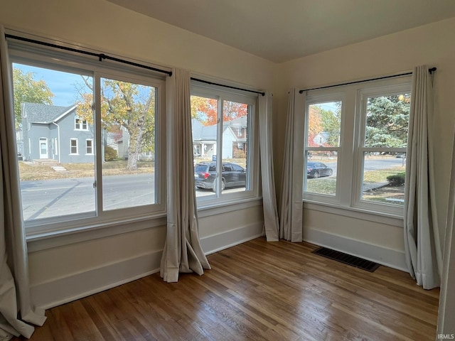 empty room featuring hardwood / wood-style floors