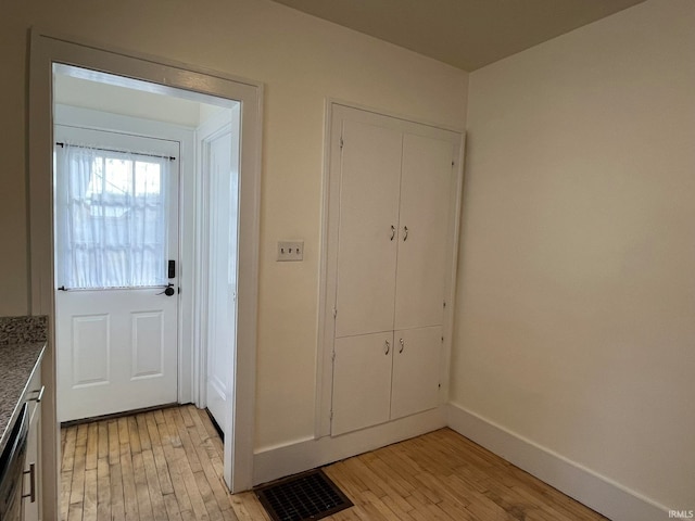 doorway to outside with light wood-type flooring