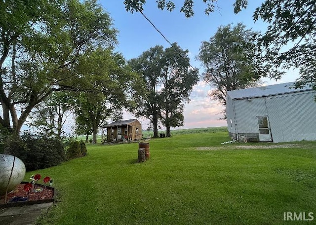 view of yard at dusk