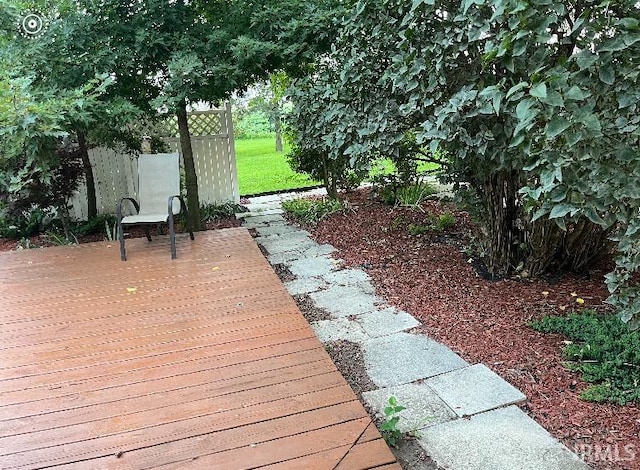 exterior space featuring a lawn and a deck