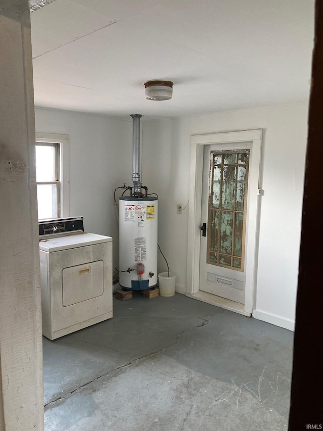 laundry area featuring gas water heater and washer / dryer