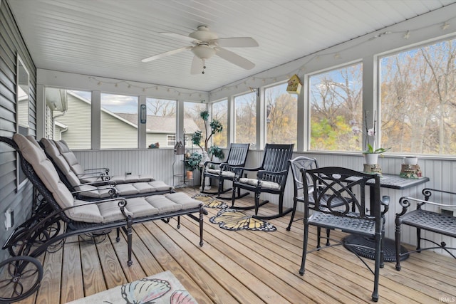 sunroom featuring a healthy amount of sunlight and ceiling fan