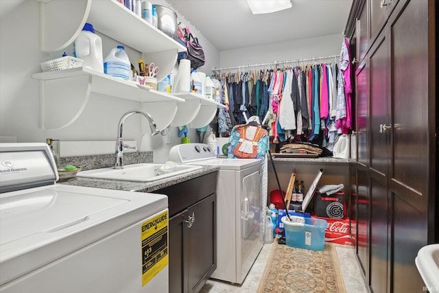 washroom with separate washer and dryer and sink