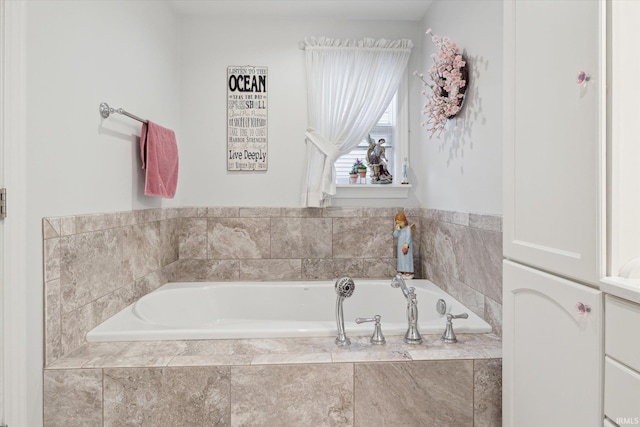 bathroom with a relaxing tiled tub