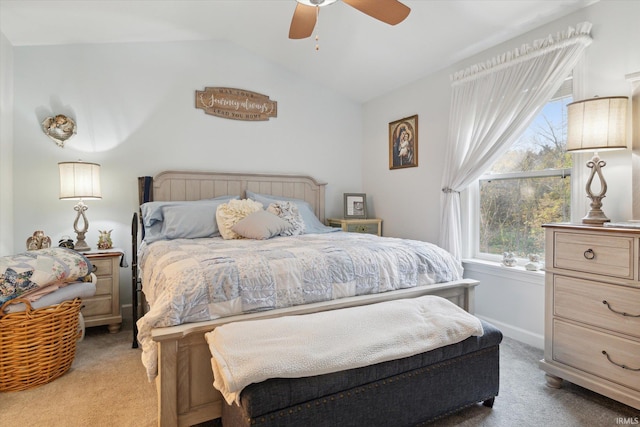 bedroom with ceiling fan, carpet flooring, and vaulted ceiling