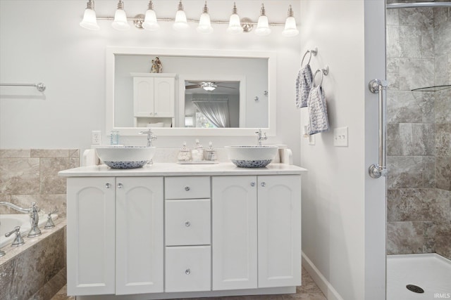 bathroom with independent shower and bath, tile patterned flooring, and vanity