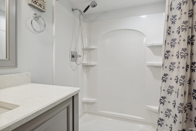 bathroom with vanity and curtained shower