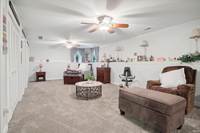 sitting room with light colored carpet and ceiling fan