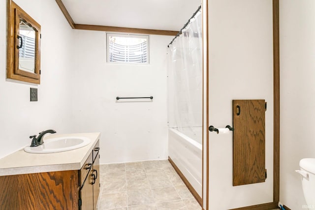 full bathroom with shower / bath combo, vanity, and toilet