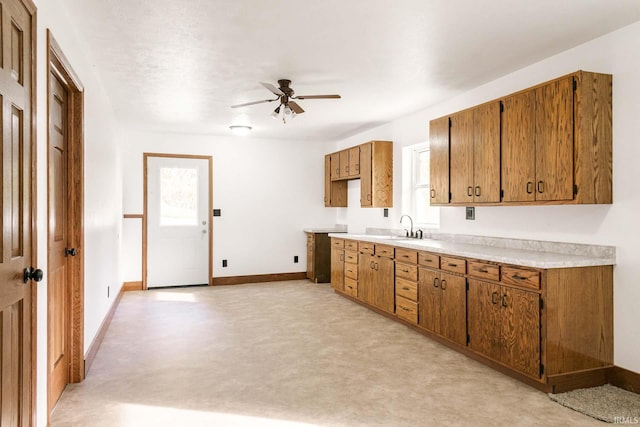 kitchen with ceiling fan and sink