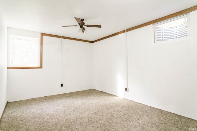 empty room featuring carpet and ceiling fan