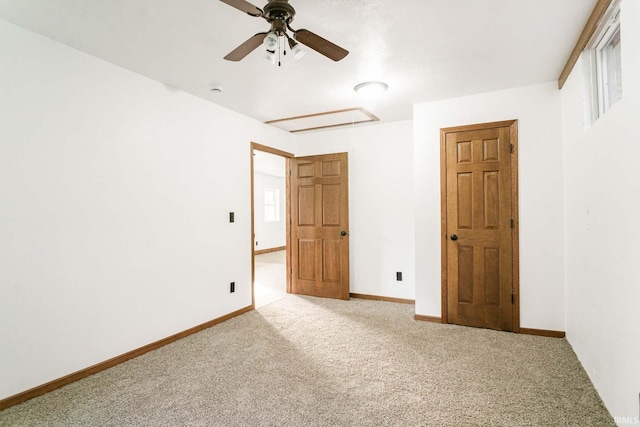 unfurnished bedroom with carpet flooring and ceiling fan