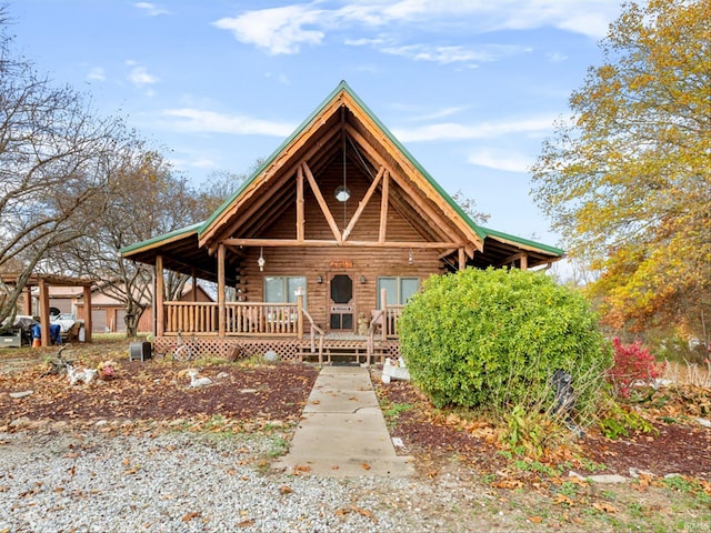 log cabin featuring a porch