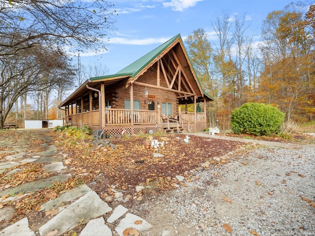 cabin with a wooden deck