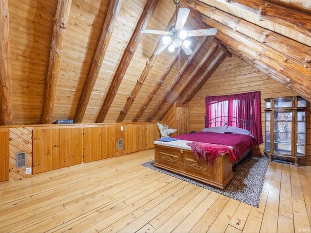 bedroom featuring wood walls, ceiling fan, wood ceiling, vaulted ceiling with beams, and light wood-type flooring