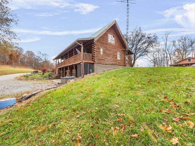 view of side of home featuring a yard