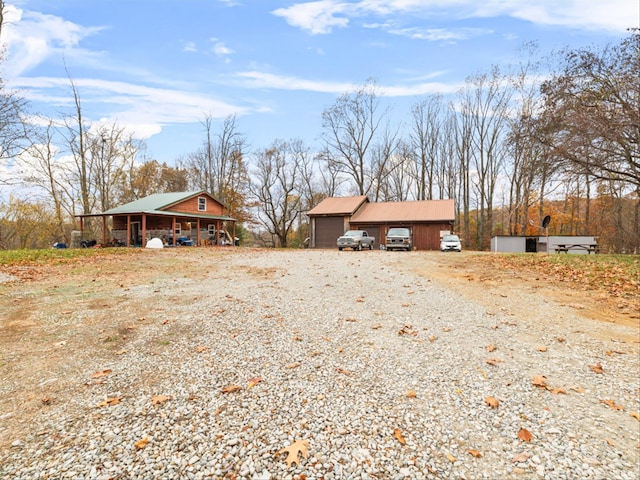 view of front of home featuring an outbuilding