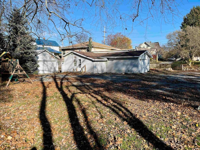 view of side of property with a lawn