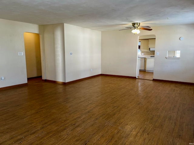 spare room with dark wood-type flooring